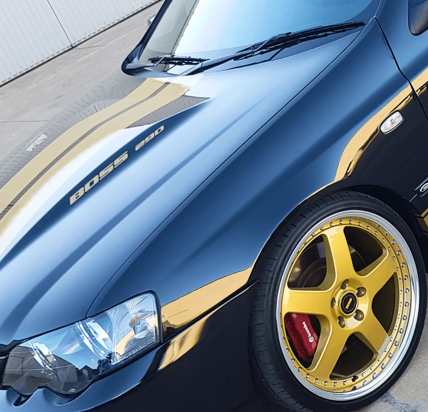Black Ford Falcon with gold stripes and tinted windows detailed by Kimberley Auto Care