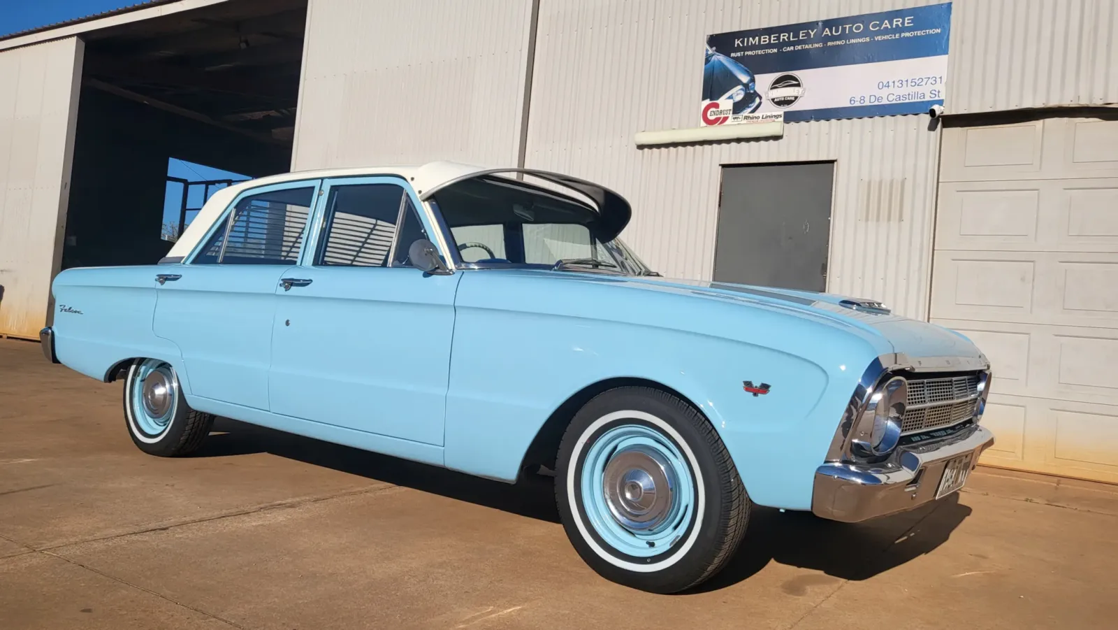 Classic baby blue Ford Falcon with white roof and whitewall tyres -detailed and polished outside Kimberley Auto Care workshop at 6-8 De Castilla Street Broome