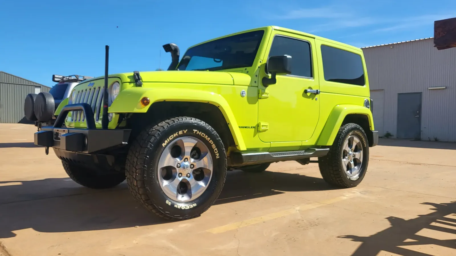 Lime green Jeep Wrangler JK with polished chrome alloys and bull bar after exterior detailing by Kimberley Auto Care