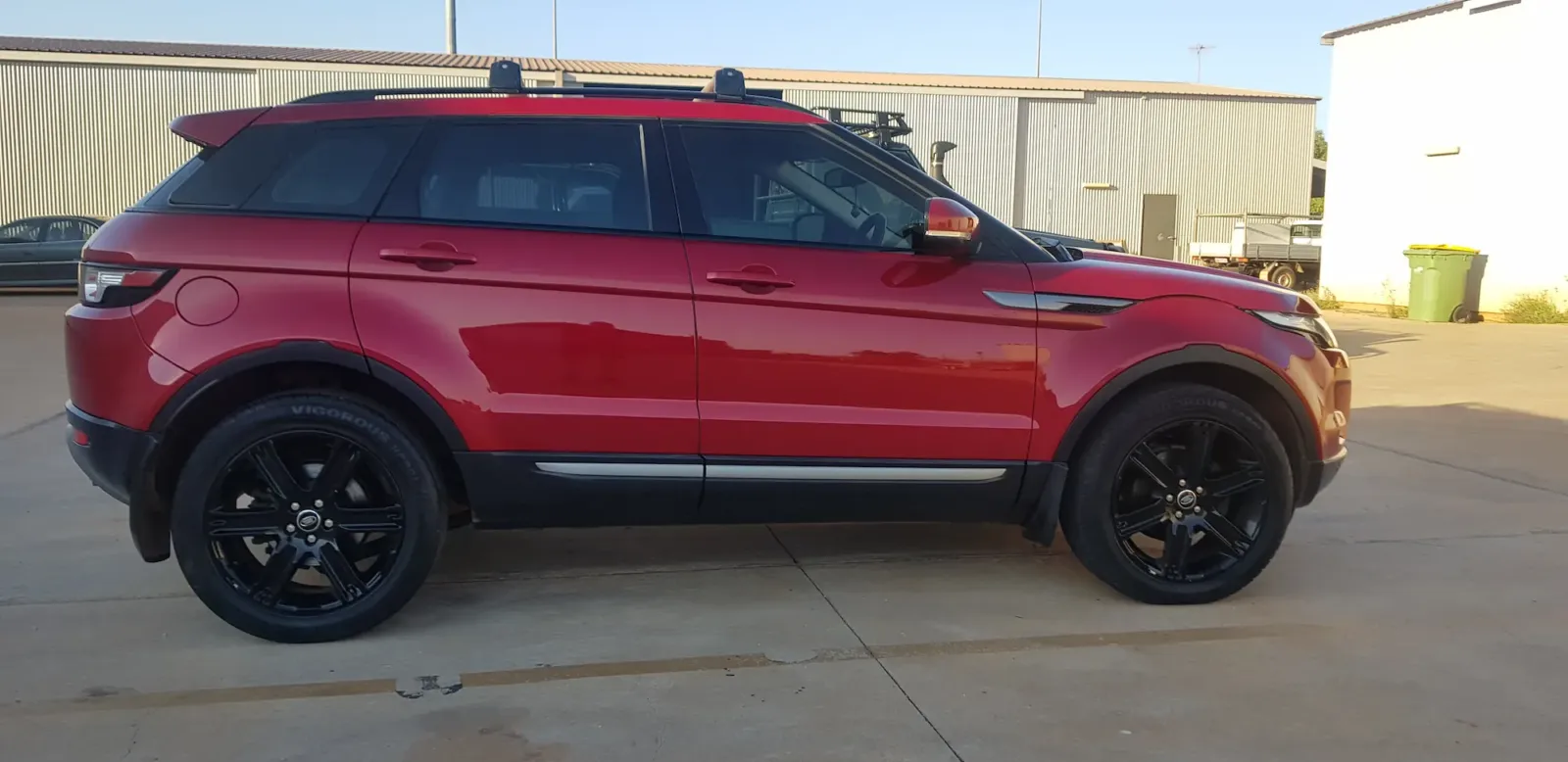 Red Range Rover Evoque with high-gloss paint finish and black alloy wheels after detailing by Kimberley Auto Care