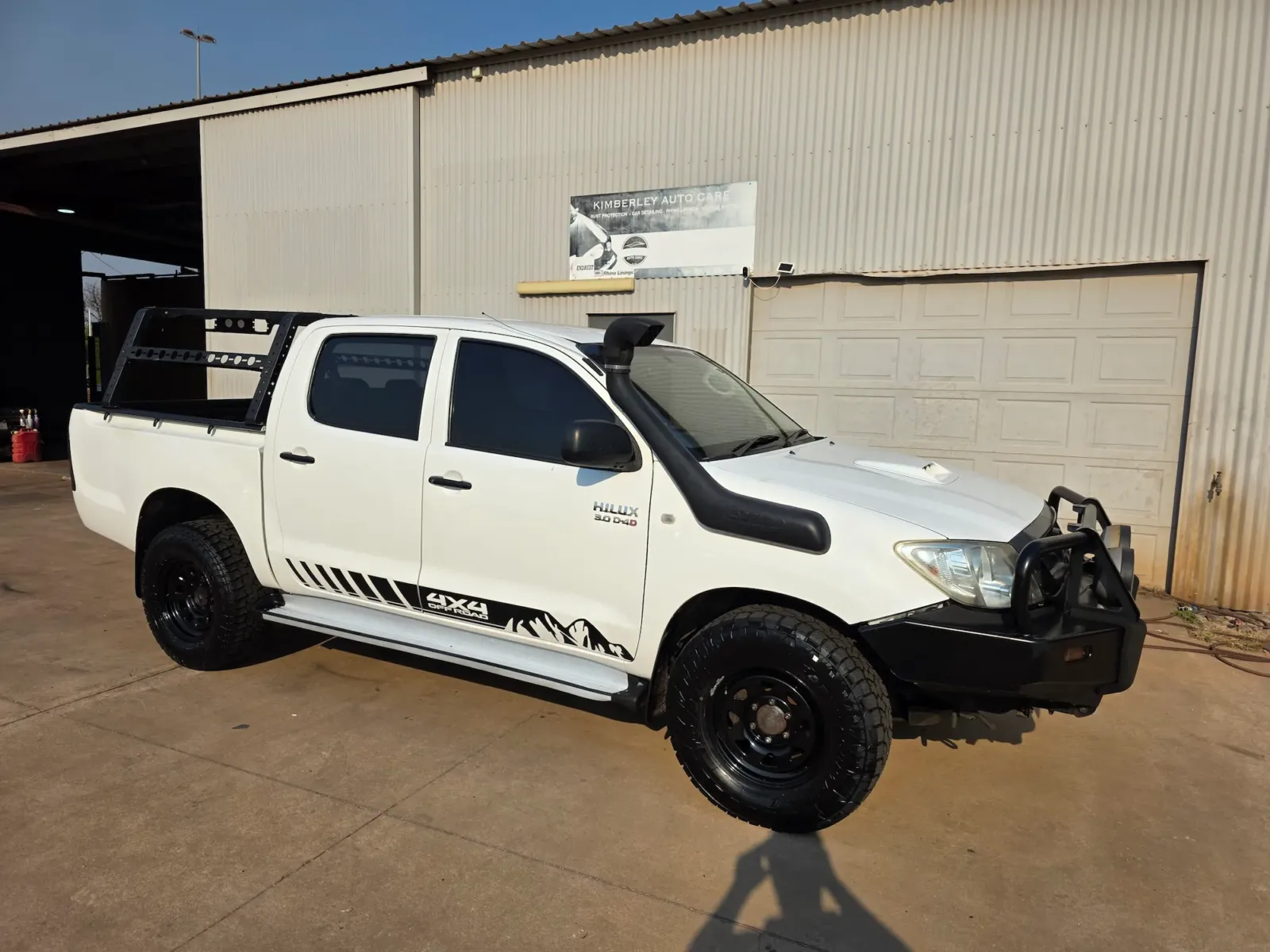 White Toyota Hilux parked at Kimberley Auto Care workshop after detailing service