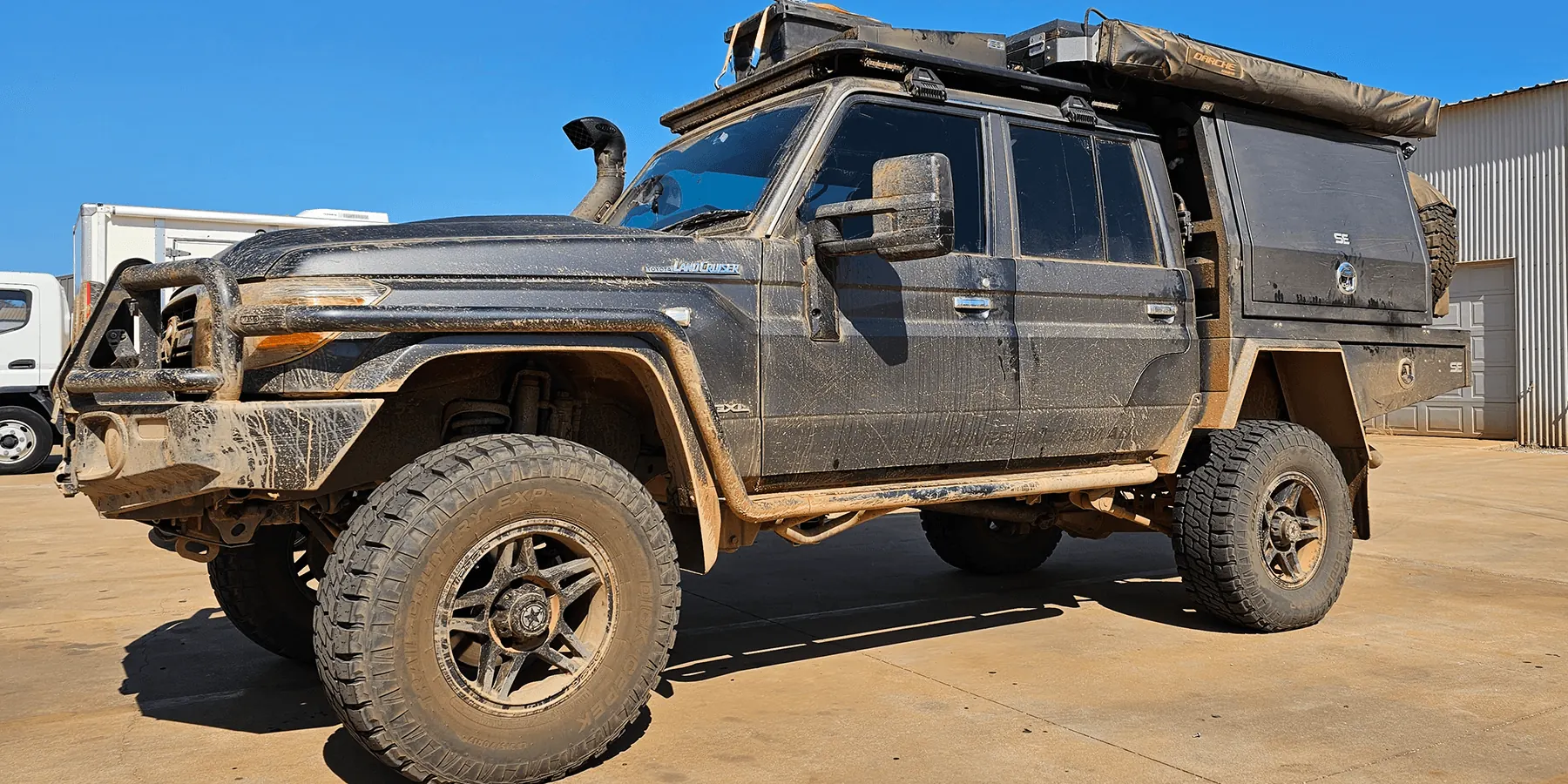 Mud-covered Toyota LandCruiser 79 Series GXL dual cab before exterior detailing by Kimberley Auto Care