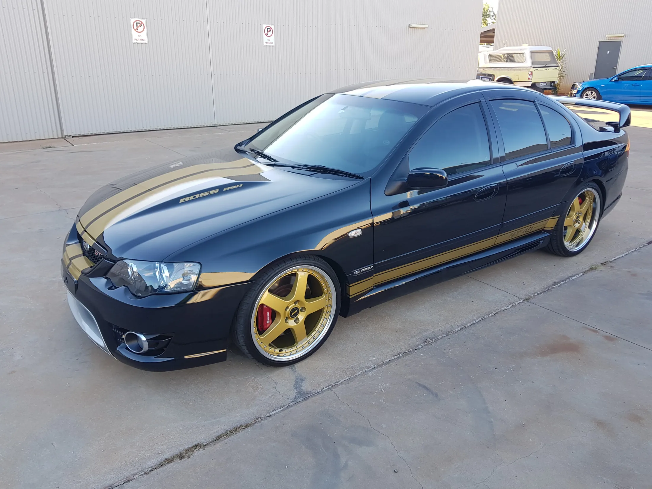 Black and gold Ford Falcon FPV GT Boss 290 with dark window tint and high-gloss paint detail by Kimberley Auto Care