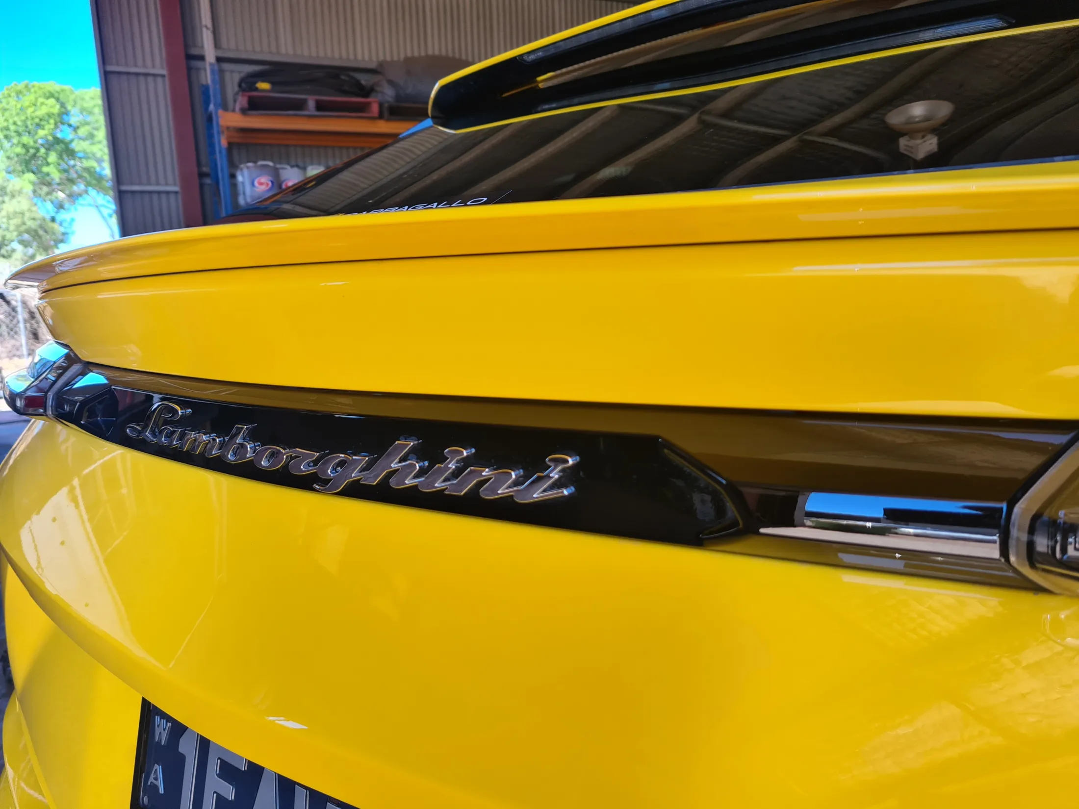 Yellow Lamborghini Urus rear badge close-up - detailed by Kimberley Auto Care in Broome WA