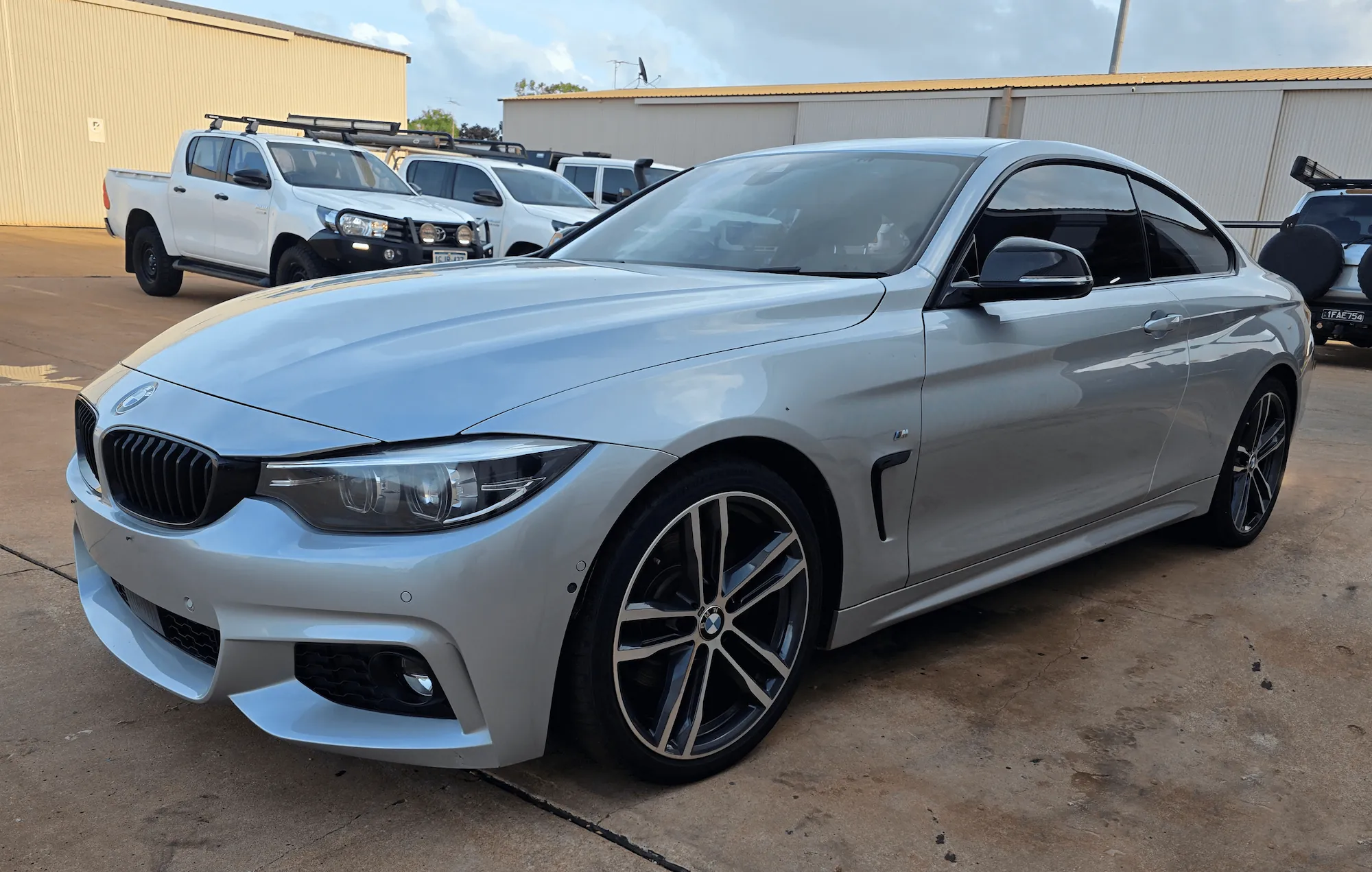 Silver BMW 4 Series coupe with paint protection and ceramic coating applied by Kimberley Auto Care in Broome