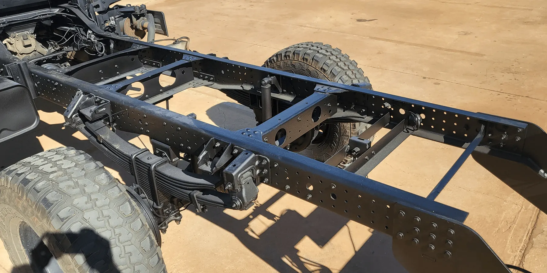 Fully sealed ladder-frame chassis coated in satin-black rust-proof finish with treated leaf springs and differential after complete chassis rust proofing by Kimberley Auto Care