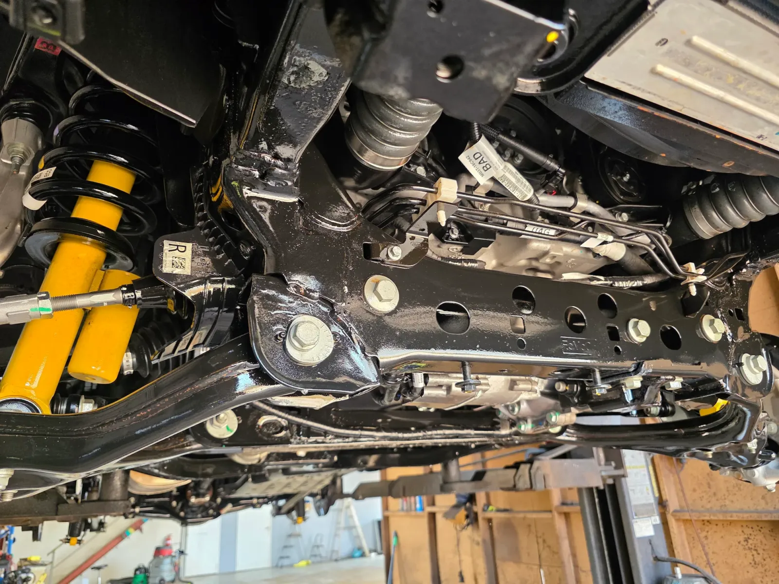 Sealed front chassis rails and subframe with Bilstein yellow shock absorbers after professional rust proofing by Kimberley Auto Care