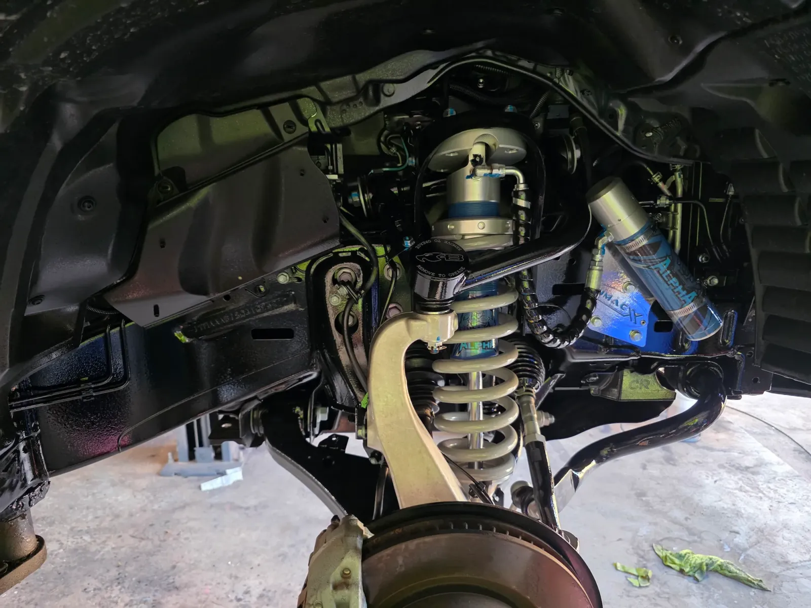 Rust-proofed front independent suspension with Alpha coilover shocks and sealed inner guard panels after undercarriage protection by Kimberley Auto Care