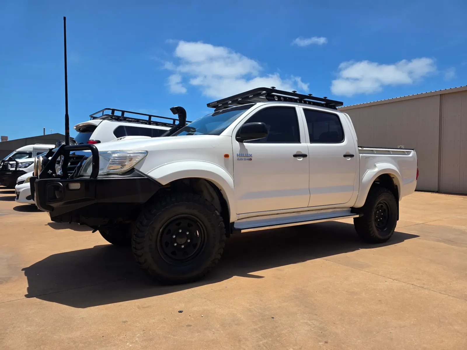Toyota Hilux dual cab with roof rack and tinted windows completed by Kimberley Auto Care