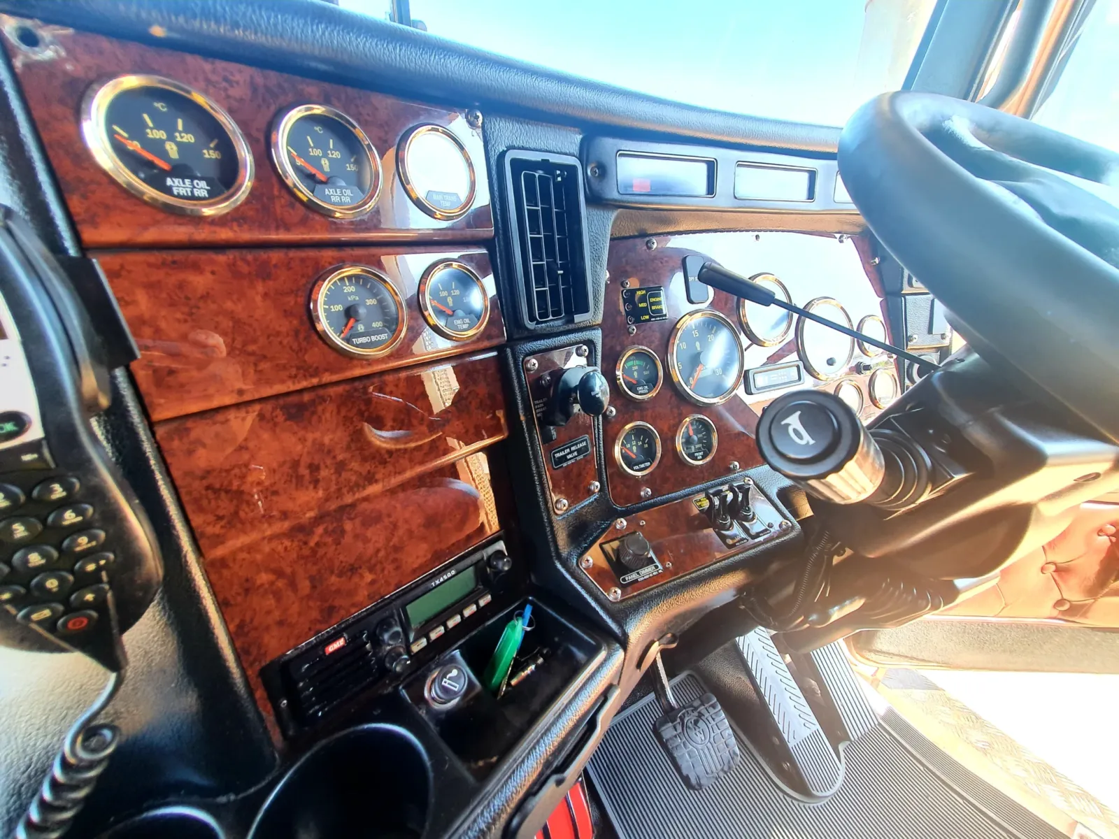 Detailed truck cabin interior showing clean woodgrain dashboard, polished gauges and controls -interior detail by Kimberley Auto Care