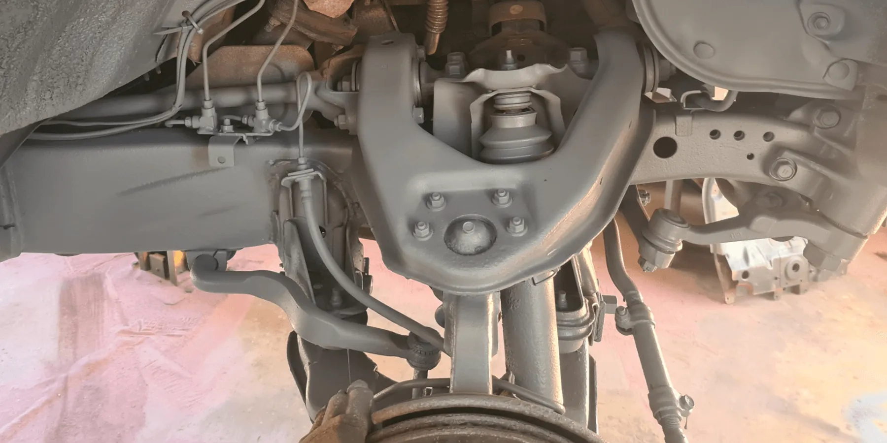 After rustproofing showing clean protected underbody chassis and suspension components treated by Kimberley Auto Care in Broome