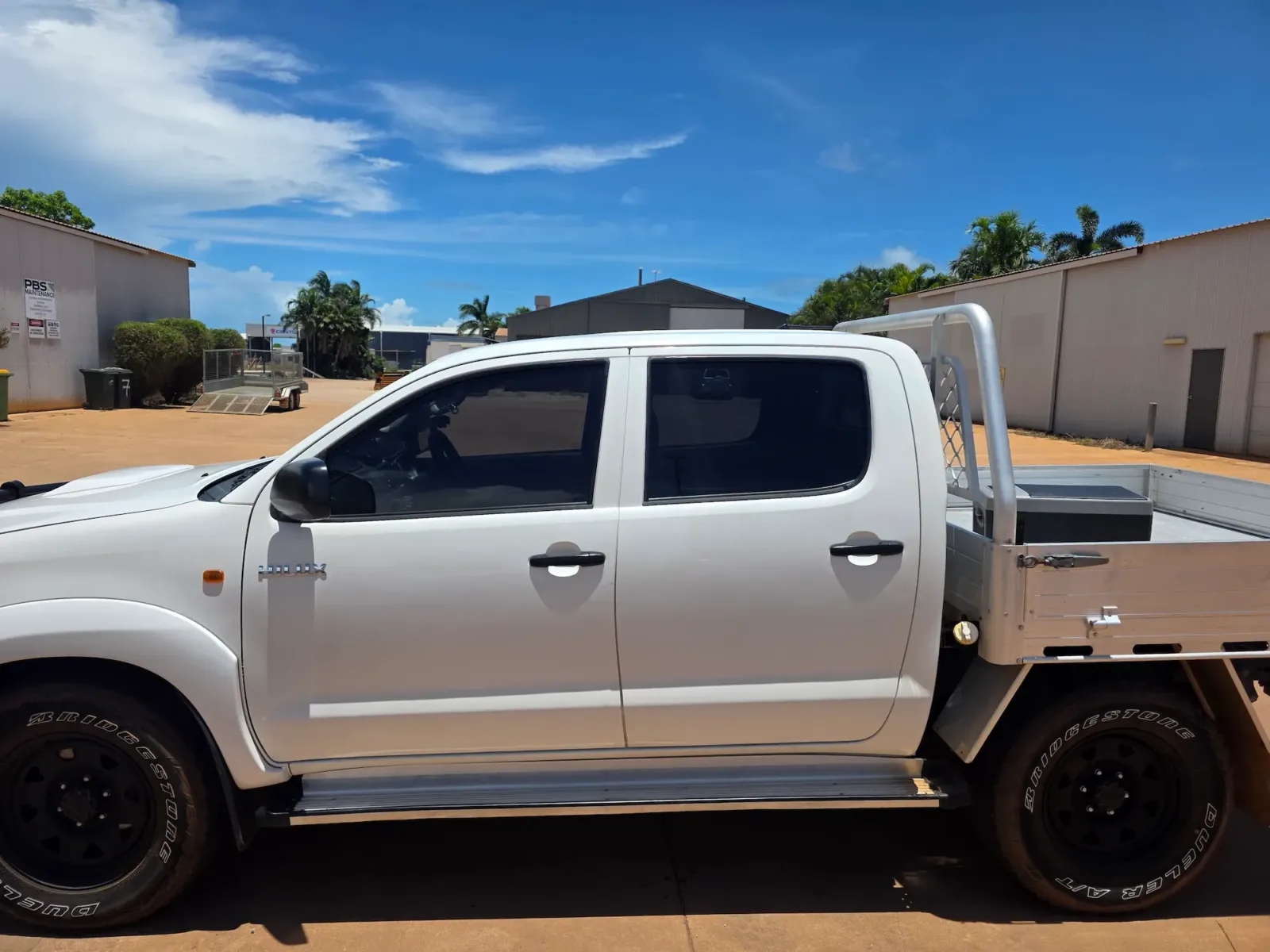 White Toyota Hilux tray back with dark window tint applied by Kimberley Auto Care