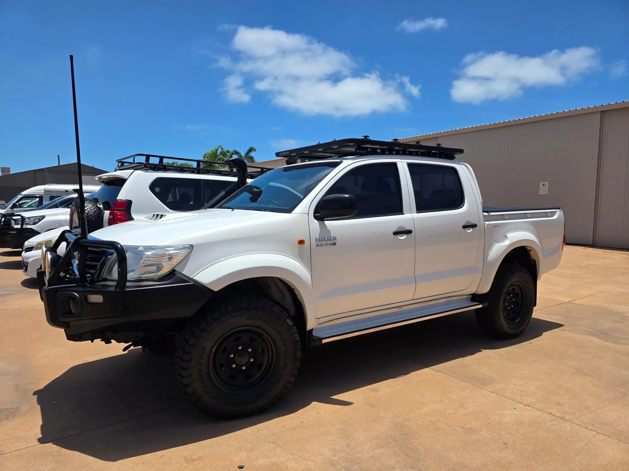 White Toyota HiLux parked outside the Kimberley Auto Care workshop in Broome.