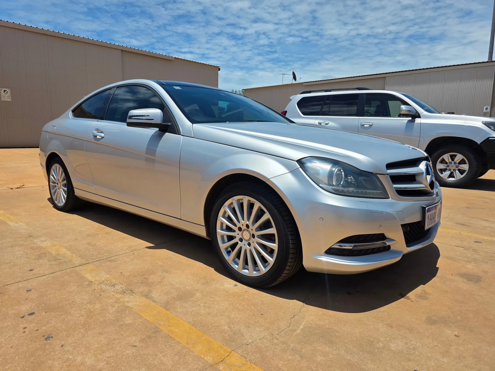 Silver Mercedes-Benz C-Class coupe with window tinting detailed at Kimberley Auto Care in Broome